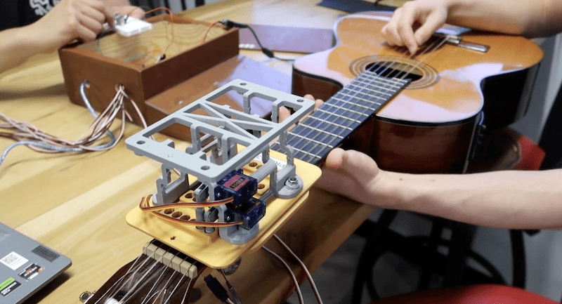 E6: Guitar Playing Assistive Device project image